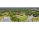 Aerial view of homes surrounded by lush greenery, lakes, and a golf course, showcasing the community's amenities at 180 Waterhall Dr., Murrells Inlet, SC 29576