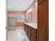 Well-appointed bathroom featuring double vanity, walk-in shower, and linen storage at 180 Waterhall Dr., Murrells Inlet, SC 29576