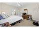 Bright bedroom features neutral tones, ceiling fan, and en-suite bathroom access at 180 Waterhall Dr., Murrells Inlet, SC 29576