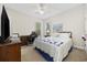 Comfortable bedroom with a bed, dresser, and windows providing natural light at 180 Waterhall Dr., Murrells Inlet, SC 29576
