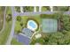 Aerial view of community pool, tennis court, playground, and clubhouse at 180 Waterhall Dr., Murrells Inlet, SC 29576