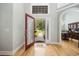 Warm and inviting foyer with hardwood floors and views of the dining room, and front yard at 180 Waterhall Dr., Murrells Inlet, SC 29576