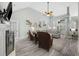 Spacious living room with high ceilings, wood floors, and lots of natural light and coastal inspired decor at 180 Waterhall Dr., Murrells Inlet, SC 29576