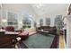 Bright living room with cathedral ceiling, multiple windows, and comfortable seating area at 180 Waterhall Dr., Murrells Inlet, SC 29576