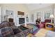 Inviting living room featuring a fireplace, cozy seating, and plenty of natural light at 180 Waterhall Dr., Murrells Inlet, SC 29576