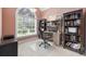 Charming office with large window, built-in bookshelves, and inviting workspace at 180 Waterhall Dr., Murrells Inlet, SC 29576