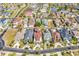 Wide aerial shot showcases a neighborhood with well-manicured lawns, diverse home styles, and winding streets at 194 Avenue Of The Palms, Myrtle Beach, SC 29579