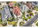 Expansive aerial view of a luxury home with a red roof, lush landscaping, and circular driveway at 194 Avenue Of The Palms, Myrtle Beach, SC 29579