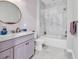 Bathroom features a marble-topped vanity, complemented by brushed gold fixtures and stylish herringbone wallpaper at 194 Avenue Of The Palms, Myrtle Beach, SC 29579