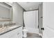 A clean bathroom featuring a granite vanity top, shower and toilet at 194 Avenue Of The Palms, Myrtle Beach, SC 29579