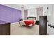 This bedroom showcases a vibrant accent wall, complete with soft window treatments and carpeted flooring at 194 Avenue Of The Palms, Myrtle Beach, SC 29579