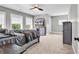 Comfortable bedroom features plush carpet, large windows, and a ceiling fan at 194 Avenue Of The Palms, Myrtle Beach, SC 29579