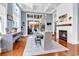 Open-concept dining room with fireplace, hardwood floors, and backyard access at 194 Avenue Of The Palms, Myrtle Beach, SC 29579