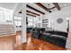Spacious living room with hardwood floors, beamed ceilings, and open layout to kitchen at 194 Avenue Of The Palms, Myrtle Beach, SC 29579