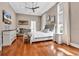 Spacious main bedroom featuring hardwood floors, tray ceilings, and bright windows with natural light at 194 Avenue Of The Palms, Myrtle Beach, SC 29579