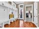 Bright mudroom with custom storage, wooden floors, and convenient access to the laundry room and exterior at 194 Avenue Of The Palms, Myrtle Beach, SC 29579