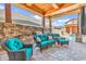 Outdoor kitchen and seating area, perfect for entertaining with its built-in grill and comfortable wicker furniture at 194 Avenue Of The Palms, Myrtle Beach, SC 29579