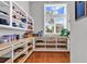 Walk-in pantry offering ample storage with shelving and wooden drawers, plus a bright window at 194 Avenue Of The Palms, Myrtle Beach, SC 29579