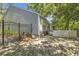 Spacious backyard featuring a fenced perimeter, patio furniture and ample space for outdoor activities at 199 Gilman Rd., Pawleys Island, SC 29585