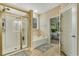 Bright full bathroom with a walk-in shower, soaking tub, and convenient access to main bedroom at 199 Gilman Rd., Pawleys Island, SC 29585