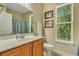 Bathroom featuring a wood vanity, modern fixtures, and a beautiful view at 199 Gilman Rd., Pawleys Island, SC 29585