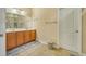 Full bathroom features a wide mirror, double sinks, and a white door to the side at 199 Gilman Rd., Pawleys Island, SC 29585