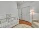Bedroom with beautiful decor, including a crib, and an accent chair, and hardwood floors at 199 Gilman Rd., Pawleys Island, SC 29585