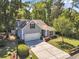 Beautiful home with a two-car garage, a large driveway, and mature trees, perfect for any Gathering at 199 Gilman Rd., Pawleys Island, SC 29585
