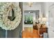 Welcoming foyer with hardwood floors, and a view of the living room, with lots of natural light at 199 Gilman Rd., Pawleys Island, SC 29585