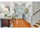 Bright foyer with hardwood floors, stylish decor, and a view of the staircase at 199 Gilman Rd., Pawleys Island, SC 29585