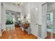 Inviting foyer with hardwood floors, decorative table, and open view to the living room, creating a warm welcome at 199 Gilman Rd., Pawleys Island, SC 29585