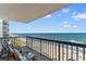 Balcony with ocean view featuring beach access, lounge chairs, and the open sky with a cool ocean breeze at 201 S Ocean Blvd., North Myrtle Beach, SC 29582