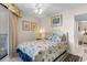 Cozy bedroom with coastal-themed decor, a queen bed, and convenient access to the balcony at 201 S Ocean Blvd., North Myrtle Beach, SC 29582