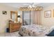 Relaxing bedroom featuring a balcony, dresser with mirror, and coastal-themed bedding at 201 S Ocean Blvd., North Myrtle Beach, SC 29582