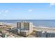 Exterior view of oceanfront high-rise buildings with beach access, providing a luxurious coastal living experience at 201 S Ocean Blvd., North Myrtle Beach, SC 29582