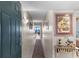 Inviting condo entryway with decorative art and a glimpse of the living area at 201 S Ocean Blvd., North Myrtle Beach, SC 29582