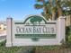 Ocean Bay Club welcome sign with lush landscaping at 201 S Ocean Blvd., North Myrtle Beach, SC 29582