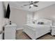 Well-lit bedroom featuring a full-size bed, a ceiling fan, and wooden flooring at 226 9Th Ave. S, North Myrtle Beach, SC 29582