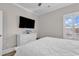 Bedroom featuring a large television screen above the dresser and a ceiling fan at 226 9Th Ave. S, North Myrtle Beach, SC 29582