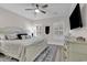Bright bedroom with white furniture, ceiling fan, and plantation shutters at 226 9Th Ave. S, North Myrtle Beach, SC 29582