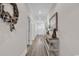 Hallway with white walls, wood floors, and decorative console table at 226 9Th Ave. S, North Myrtle Beach, SC 29582