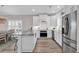 Modern kitchen featuring granite countertops, stainless steel appliances, and white cabinetry at 226 9Th Ave. S, North Myrtle Beach, SC 29582