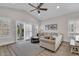 Bright living room with vaulted ceiling, ceiling fan, and sliding glass doors at 226 9Th Ave. S, North Myrtle Beach, SC 29582