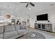 Living room with hardwood floors, TV, and gray sofa at 226 9Th Ave. S, North Myrtle Beach, SC 29582