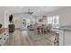 Open-concept living room and dining area with wood floors and abundant natural light at 226 9Th Ave. S, North Myrtle Beach, SC 29582
