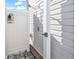 Close-up of outdoor shower with white privacy fence and gray brick flooring at 226 9Th Ave. S, North Myrtle Beach, SC 29582