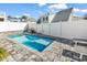 Inviting in-ground pool with a stone tile patio and a white privacy fence surrounding the backyard at 226 9Th Ave. S, North Myrtle Beach, SC 29582