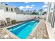 Backyard pool with lounge chairs and a white privacy fence at 226 9Th Ave. S, North Myrtle Beach, SC 29582