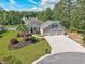 Beautiful single Gathering home with three-car garage, mature landscaping, and brick accents at 229 Duchess Ct., Myrtle Beach, SC 29588