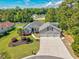 Aerial view of a home showcasing its landscaped yard, multiple-car garage, and inviting curb appeal at 229 Duchess Ct., Myrtle Beach, SC 29588